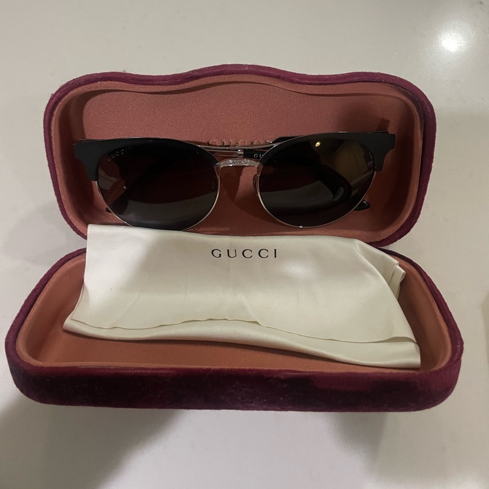 Gucci sunglasses. Comes with Gucci case and cloth.